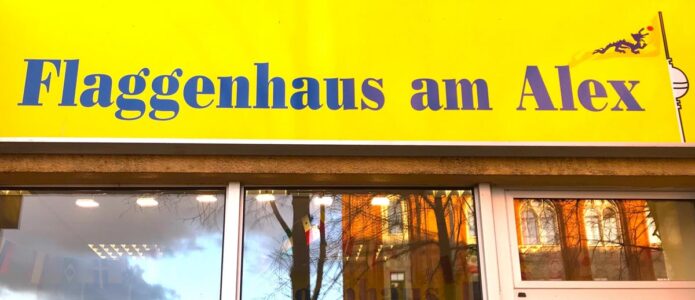 flaggenhaus leuchtwerbung mit schriftzug